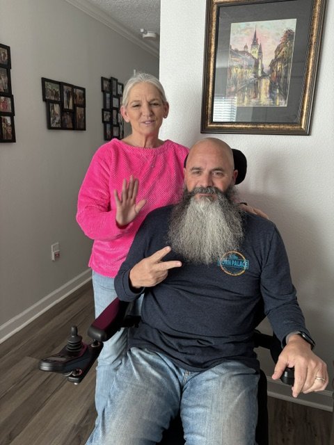 Chris at home with family, smiling
